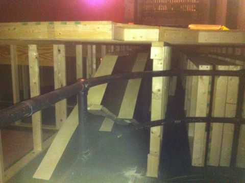 View of the stair units being stored under the orchestra platform during Elixir of Love.