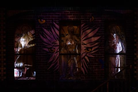 Closer view of the upstairs upstage wall with doors open and see thru effect on scrim.