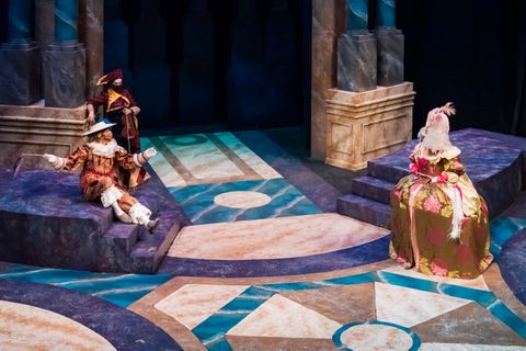 Closer view of the curved platforms and column pedestals for Measure for Measure during a performance.